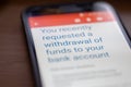 You requested withdrawal of funds to bank account message on smartphone screen closeup Royalty Free Stock Photo