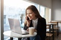 You are right she really gained weight. Beautiful european female office worker, sitting in cafe during lunch, drinking Royalty Free Stock Photo