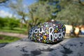 You rock encouraging message painted in script on kindness rock