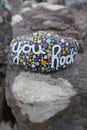 You rock written in script on polka dot kindness rock Royalty Free Stock Photo