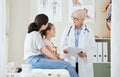 You seem to be very healthy. a mature female doctor talking to a patient at a hospital. Royalty Free Stock Photo