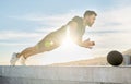 You set the bounderies and only you decide whether to quit or not. a sporty young man out on a rooftop for a workout.