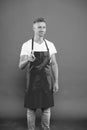 You should try this. man staff in uniform. Professional approach to business. you are next. mature man in apron pointing