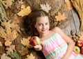 This is for you. Small girl likes the taste of apple fruits. Cute child with ripe autumn crops. Organic and natural food