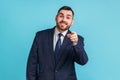 You are special. Young adult man with beard wearing official style suit pointing fingers at camera Royalty Free Stock Photo