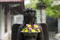 A Statue Of A Woman In A Buddhist Monastery Located In Mendut Temple