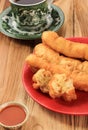 Cakwe or Chinese Oil Bread  Stick is Indonesian Traditional Food for Breakfast Served in Ceramic Plate on Wooden Table Royalty Free Stock Photo