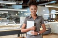 You are unstoppable if you have a strong vision. Attractive african american worker standing in office Royalty Free Stock Photo