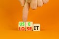 You use or lose it symbol. Concept word Use It or lose it on wooden cubes. Beautiful orange table orange background. Businessman Royalty Free Stock Photo