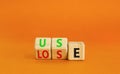 You use or lose it symbol. Concept word Use or lose on wooden cubes. Beautiful orange table orange background. Business and you Royalty Free Stock Photo