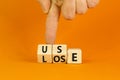 You use or lose it symbol. Concept word Use or lose on wooden cubes. Beautiful orange table orange background. Businessman hand. Royalty Free Stock Photo