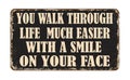 You walk through life much easier with a smile on your face vintage rusty metal sign