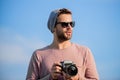 Because you want to remember forever. travel with camera. male fashion style. looking trendy. photographer in glasses Royalty Free Stock Photo