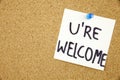 You Are wellcome sign written on sticky note pinned on pinboard Royalty Free Stock Photo