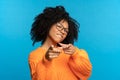 You what we need: black woman choose you point fingers front. Happy black female gesture to camera Royalty Free Stock Photo