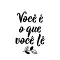 You Are What You Read in Portuguese. Lettering. Ink illustration. Modern brush calligraphy Royalty Free Stock Photo