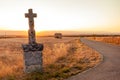 Highlighted cross memorial monument along the side of the road Royalty Free Stock Photo