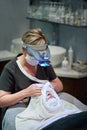 You wont believe the difference when Im done. a woman getting a facial treatment at a clinic.