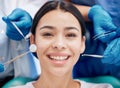 You wont stop smiling. a young woman looking happy in her dentists office.