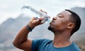 You worked hard and did well today. a sporty young man drinking water while exercising outdoors. Royalty Free Stock Photo