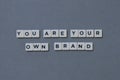 ' You Are Your Own Brand ' word made of square letter word on grey background Royalty Free Stock Photo