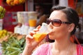 Yougn woman with glass of fresh fruit juice