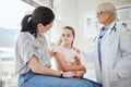 Youll be better soon. a mature female doctor talking to a patient at a hospital. Royalty Free Stock Photo