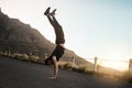 Youll become stronger and more flexible than before. a sporty young man doing a handstand while exercising outdoors. Royalty Free Stock Photo