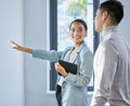 Youll enjoy the view. a young female real estate agent showing a client a house. Royalty Free Stock Photo