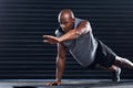 Youll never regret bettering yourself. a handsome young man doing push-ups.