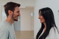 Youn in love students exchange tender emotions while embracing in the university hallway, capturing the essence of their