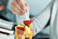 Youn man eating a fruit salad at the office Royalty Free Stock Photo