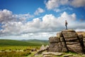 Youn man standing on South Hessary Tor near Princeton in Dartmoor,Devon, UK Royalty Free Stock Photo