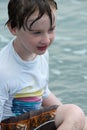 Yound toddler boy having fun digging in the sand at the beach Royalty Free Stock Photo