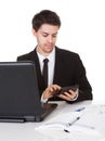 Young accountant making calculations Royalty Free Stock Photo