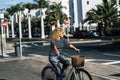 Young active adult woman use bike and take a ride in the town. People and outdoor leisure activity. Green transport alternative Royalty Free Stock Photo