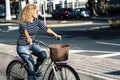 Young active adult woman use bike and take a ride in the town. People and outdoor leisure activity. Green transport alternative Royalty Free Stock Photo