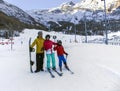 Young active family enjoys winter sports in the charming Swiss resort of Saas-Fee