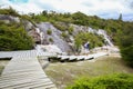 Young active father with little daughter . Thermal area Orakei Korako in New Zealand Royalty Free Stock Photo