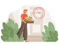Young active man at the door of the house with a box of fresh vegetables. The concept of fast food delivery to your home, store of