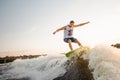 Young active man riding on the wakeboard Royalty Free Stock Photo