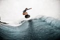 Young active woman surfs coolly on surf board and jumps on the wave