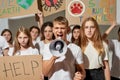 Young activists with peaceful and antiwar placards