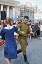 Young actors dressed as army soldiers performing on the Theater Square