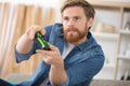 young addicted man playing video games in living room