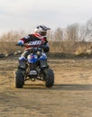 Young adept steering training a ride on a small quad. Royalty Free Stock Photo