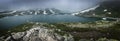 Young admiring the natural beauty of a glaciar lake in Swiss Alps Royalty Free Stock Photo