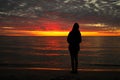 A Young Adolescent Girl Looks up in Awe, Wonder, and Admiration at a Magnificent Sunset Sky Royalty Free Stock Photo