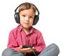 Young boy with headphones listening the music Royalty Free Stock Photo