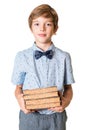 Young boy holding stack of books Royalty Free Stock Photo